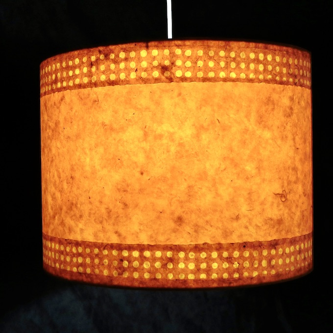 hanging lit orange lotka pendant size 13x17