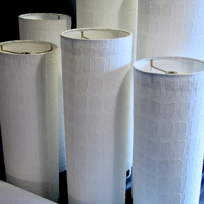 Set of unlit tall and narrow cylinder pendants with white window pane style paper