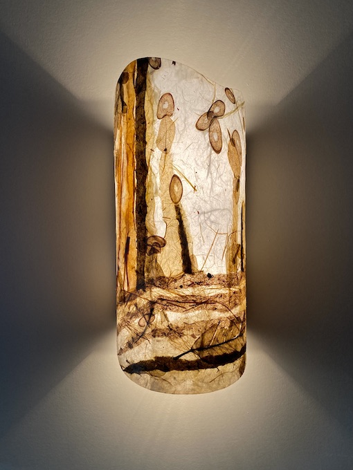 one lit Sconce with feeling of Forest warm tones