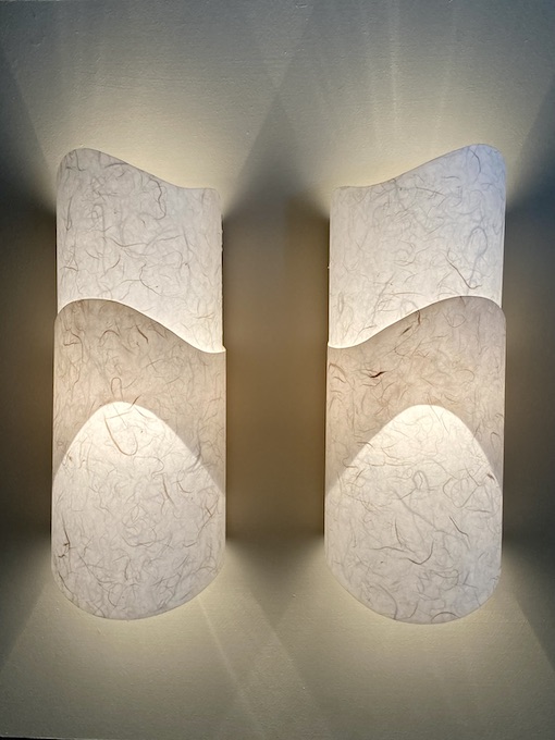 set of two wall sconces with waves in neutral paper